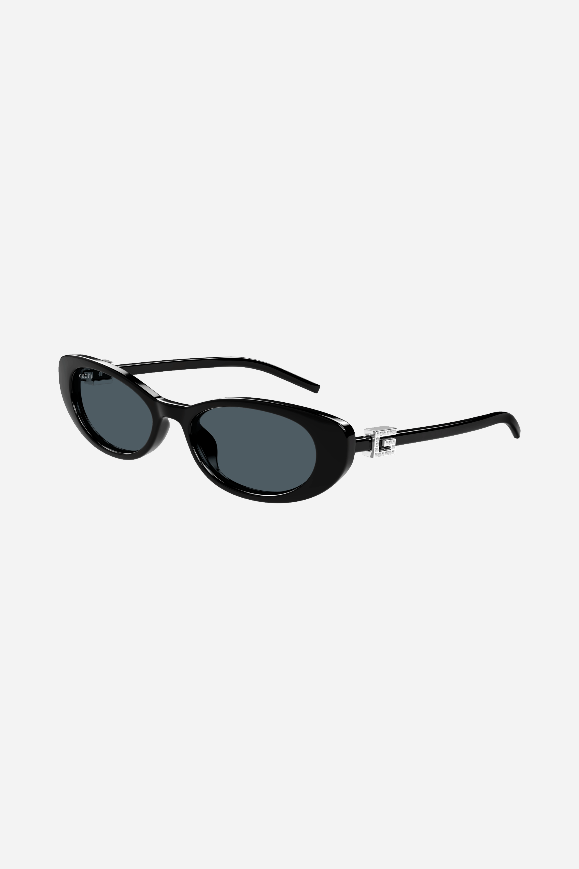 Gafas de sol Gucci negras con forma de ojo de gato y logotipo grabado