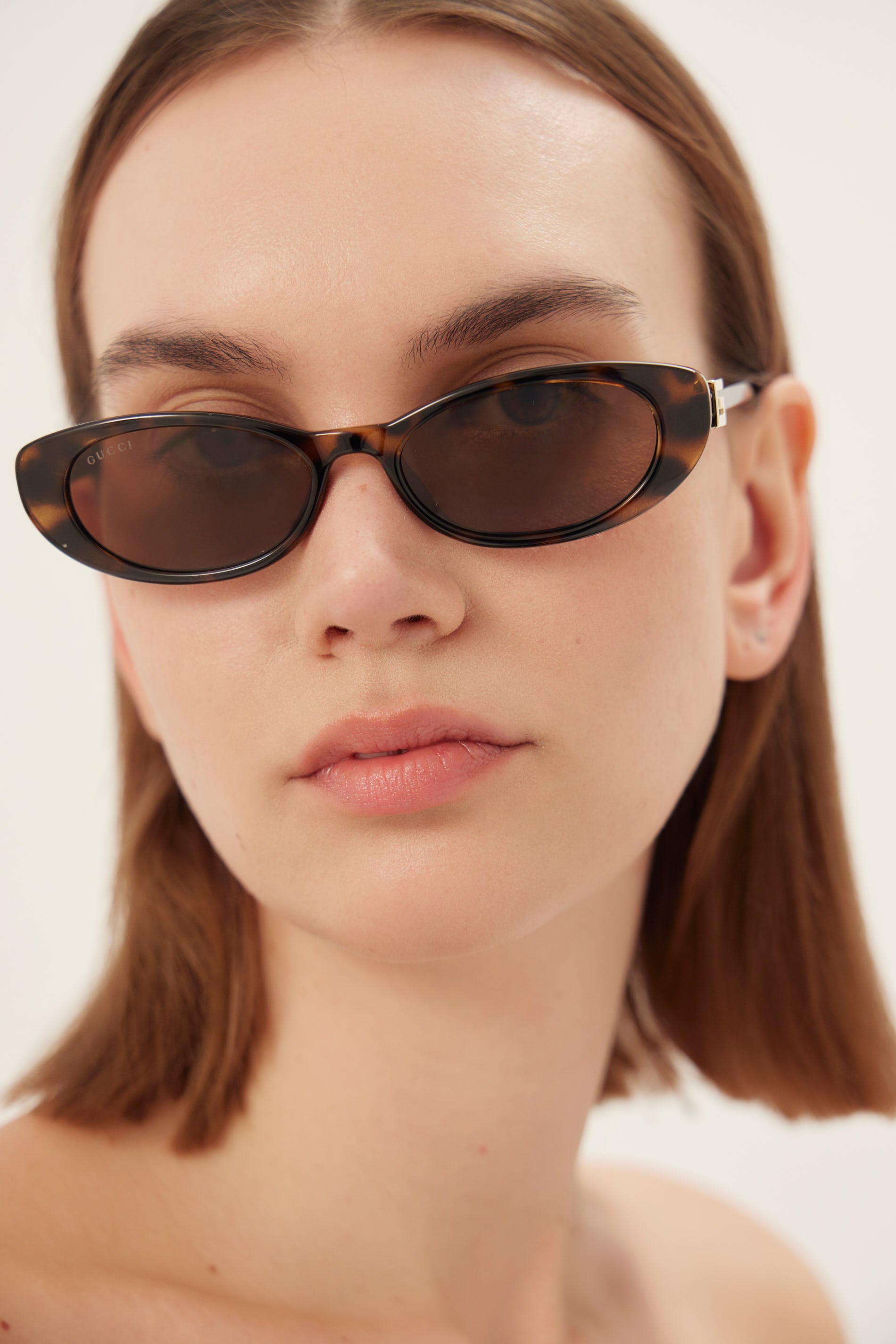 PRE-ORDINE - Occhiali da sole Gucci ovali cat-eye color havana con logo dorato