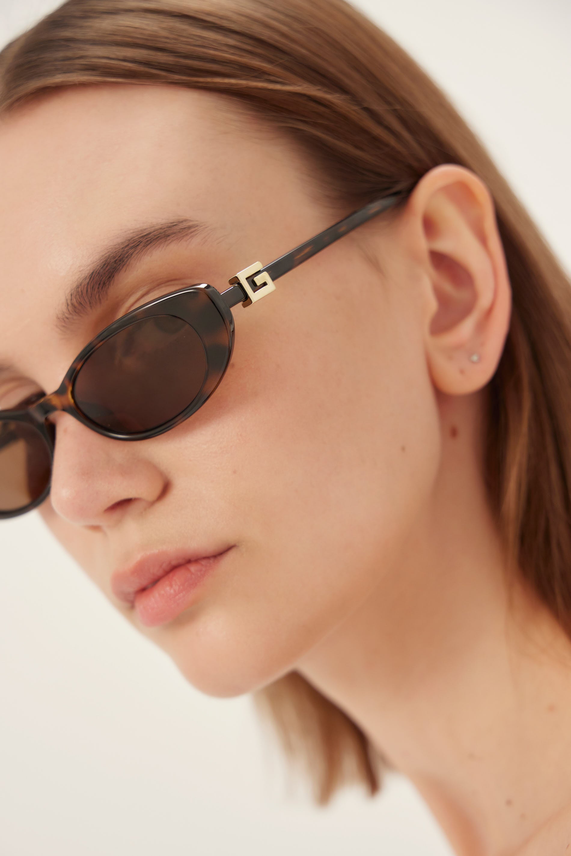 PRE-ORDINE - Occhiali da sole Gucci ovali cat-eye color havana con logo dorato